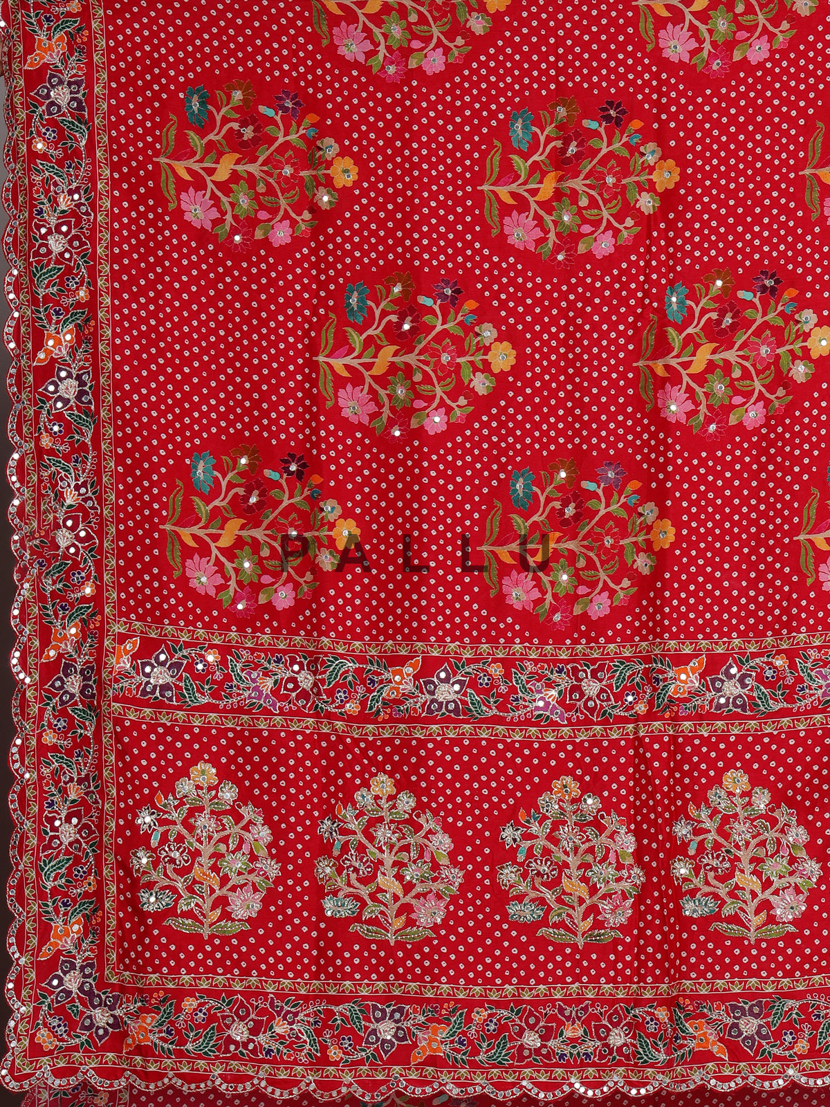 Red muslin silk saree with bandhani print and traditional aabla embellishments