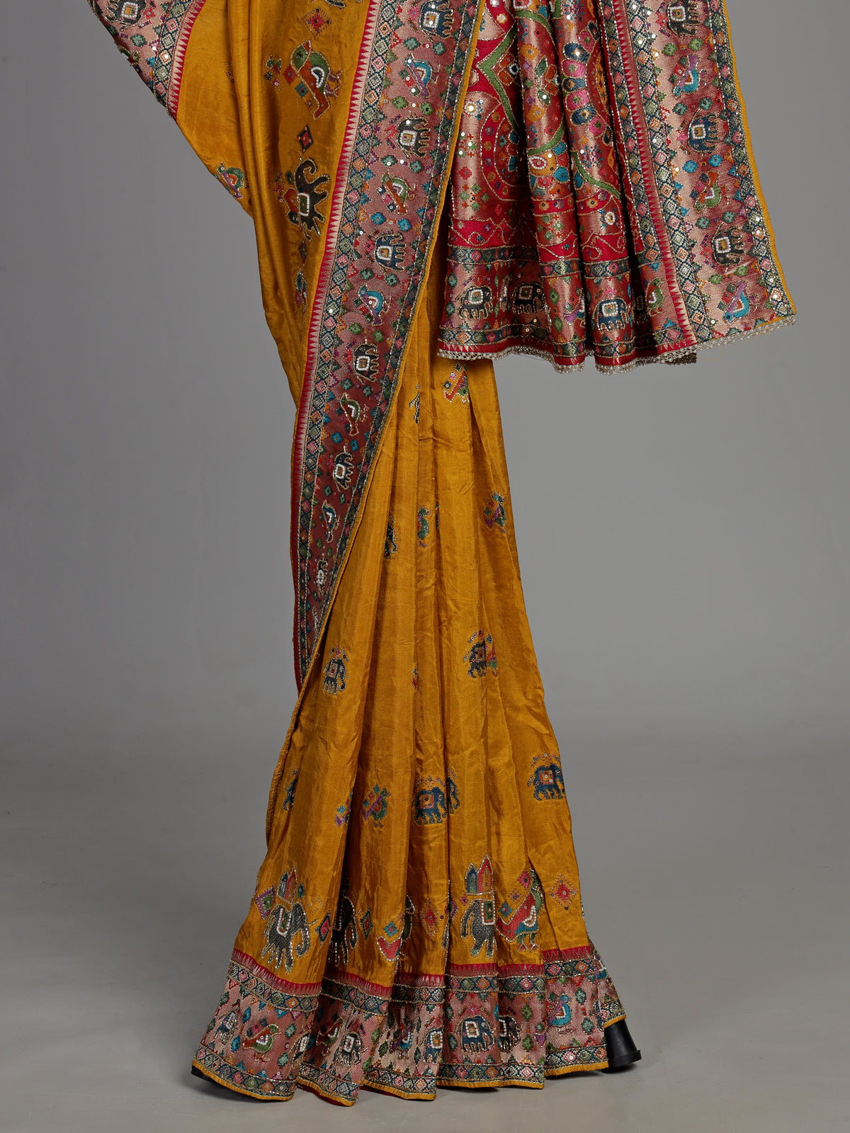 Mustard yellow pashmina saree with elephant motifs and contrasting pallu