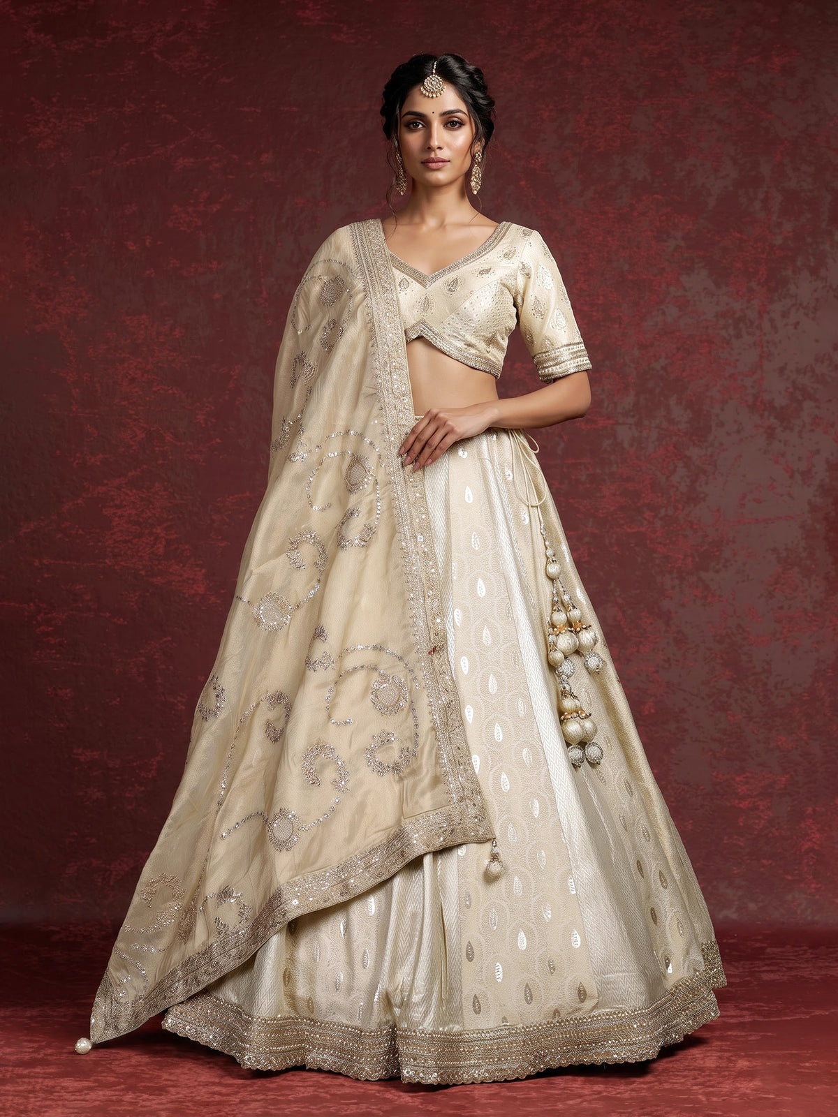 Cream banarasi silk lehenga choli with intricate zardosi embellishments