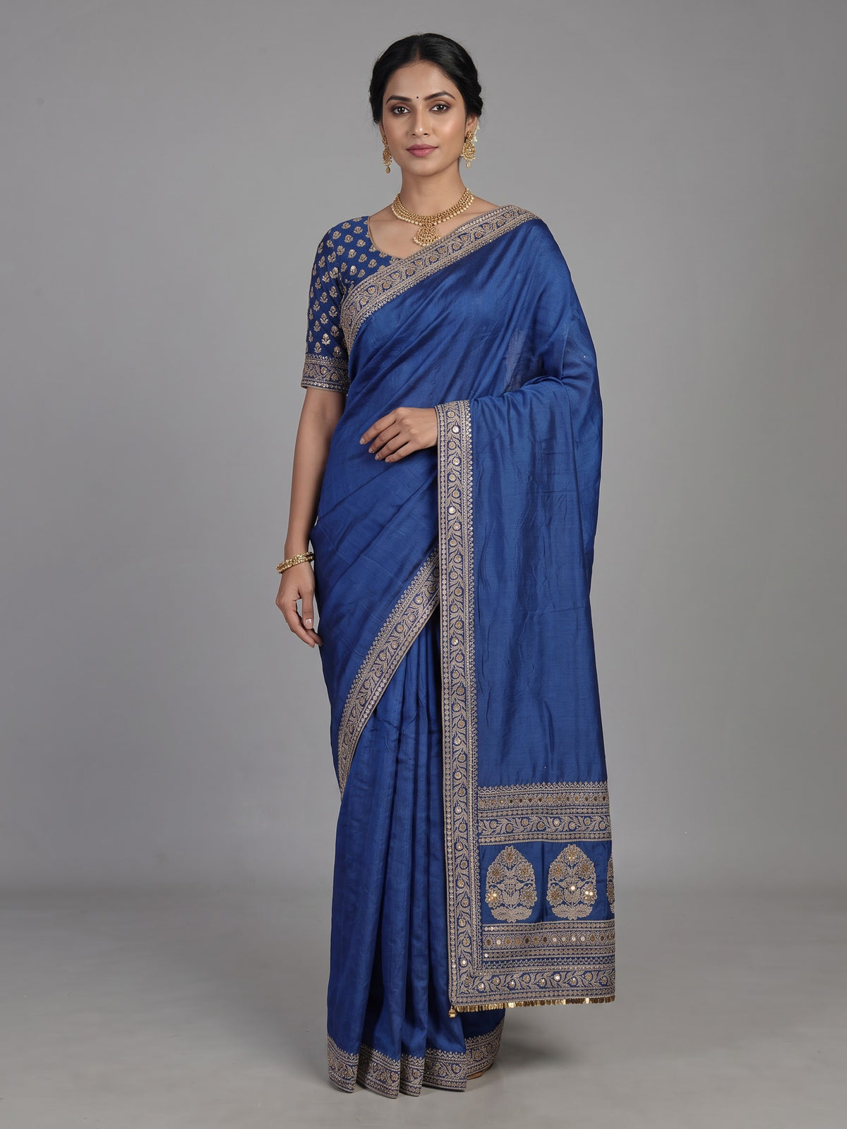 Royal blue silk saree with intricate embroidery and sequin detailing