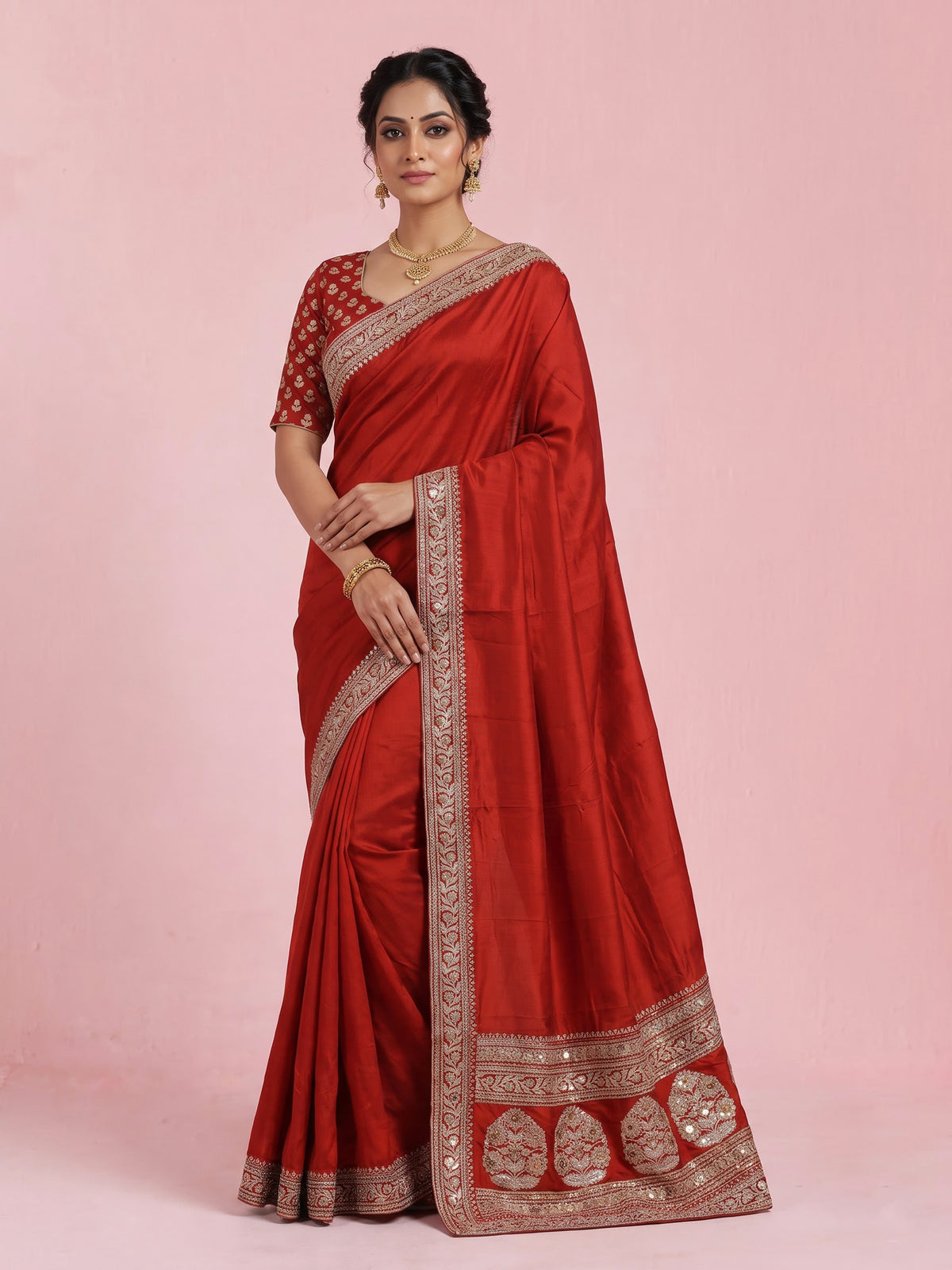 Elegant rust red silk saree with embroidered pallu and sequins