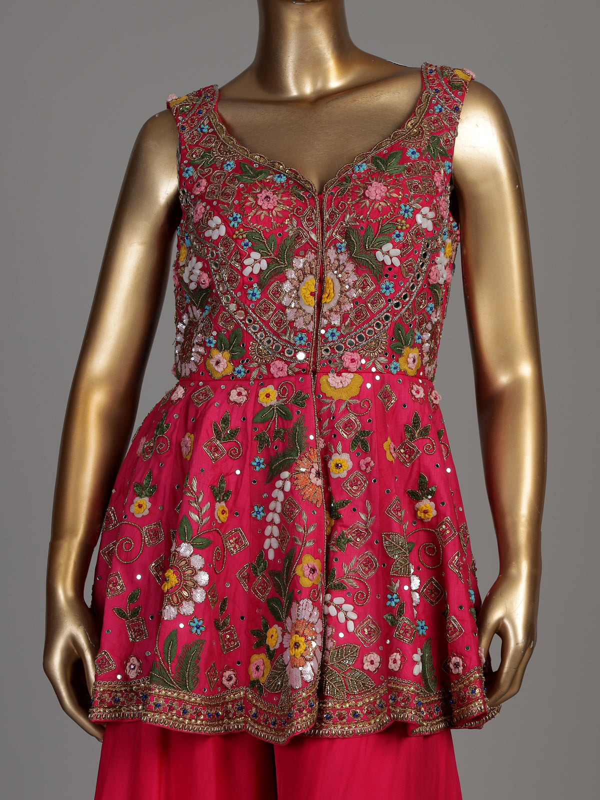 Rani pink silk palazzo suit with mirror work and net dupatta