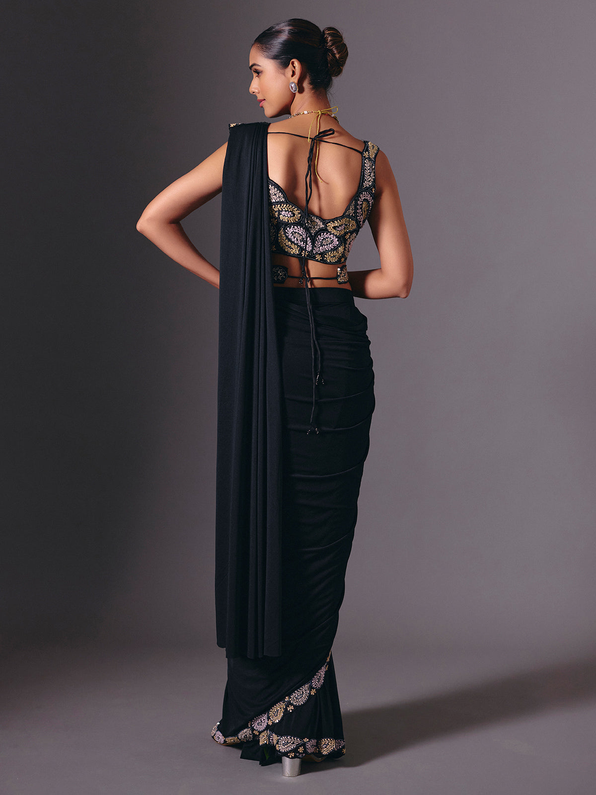 Black cruss lycra saree with sparkling bead embellishments