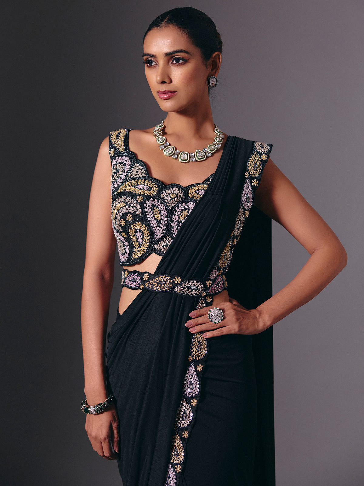 Black cruss lycra saree with sparkling bead embellishments