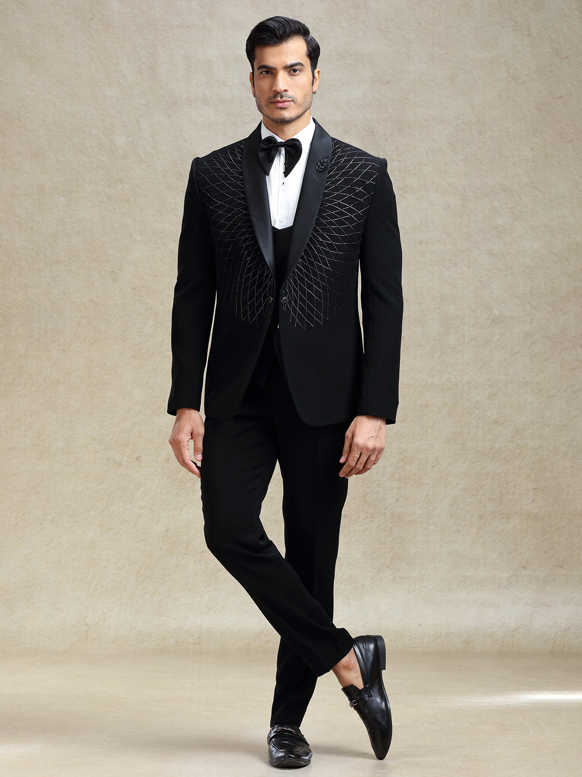 Black reception wear tuxedo suit in cutdana work