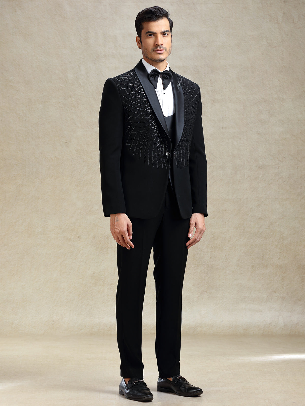 Black reception wear tuxedo suit in cutdana work