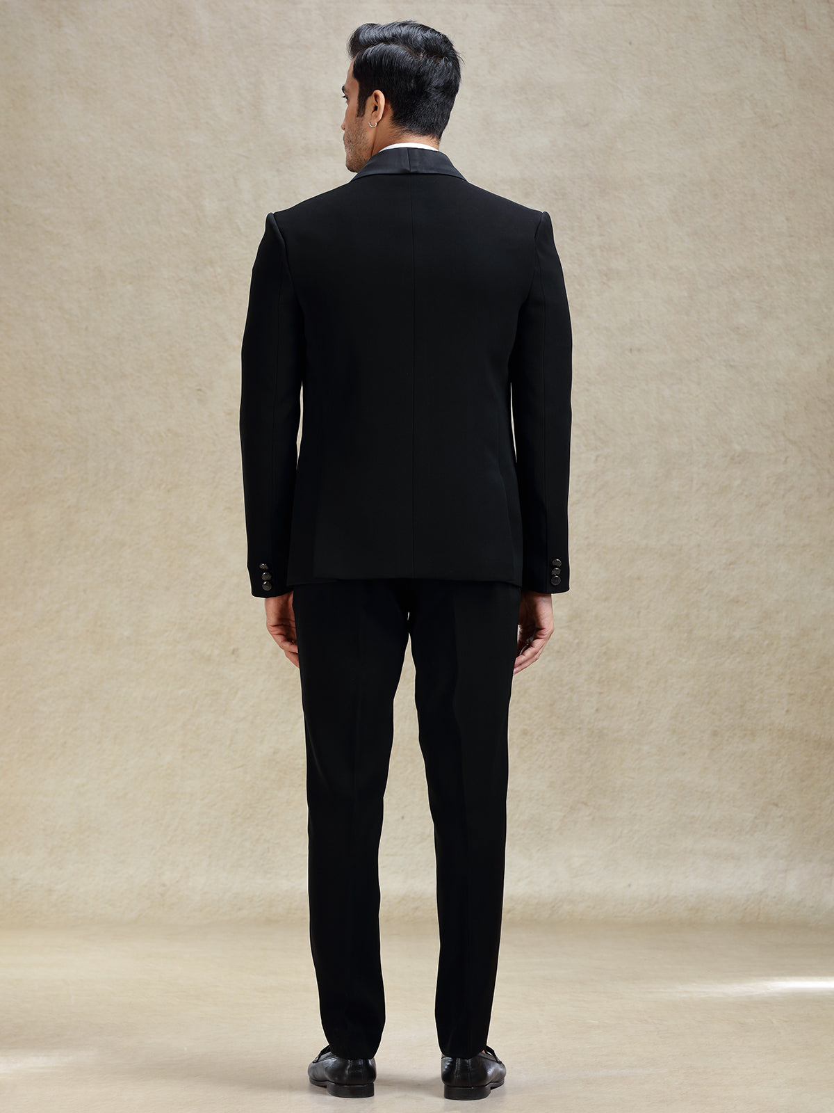 Black reception wear tuxedo suit in cutdana work
