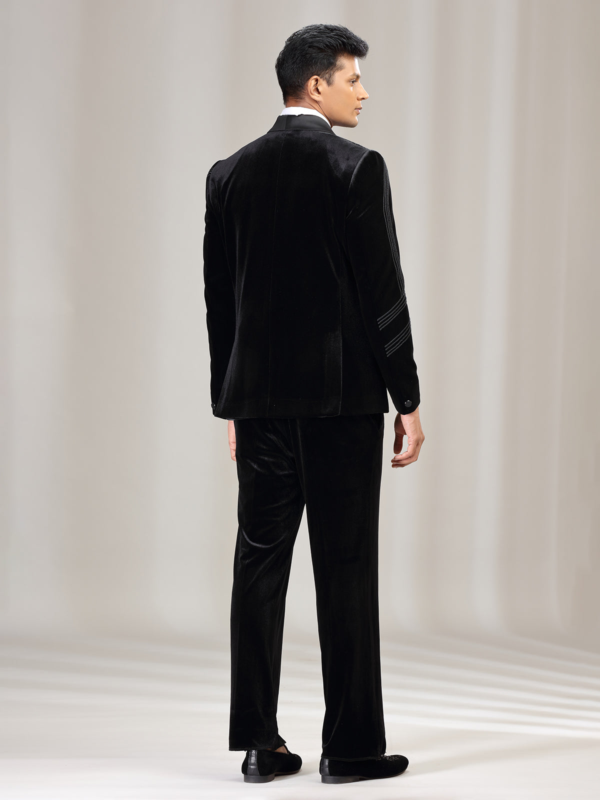 Black velvet coat suit with reception wear