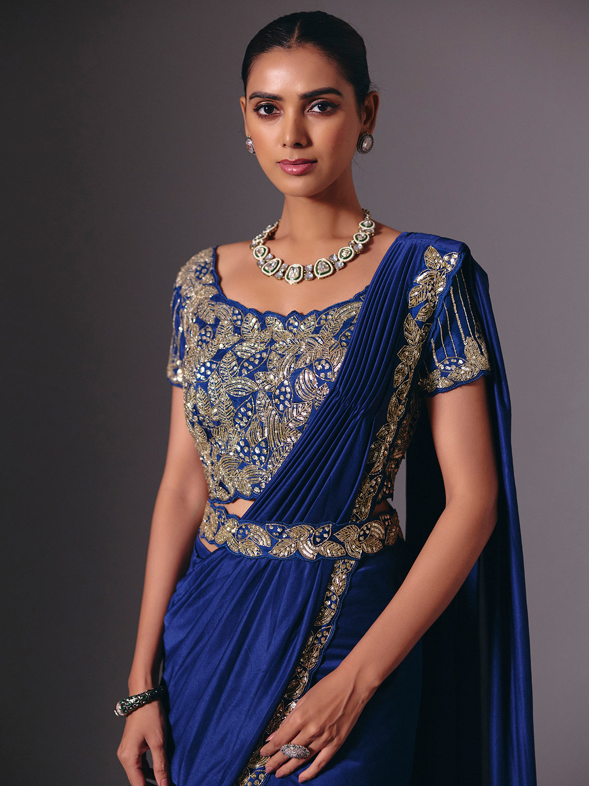 Blue satin lycra saree with sparkling festive embellishments
