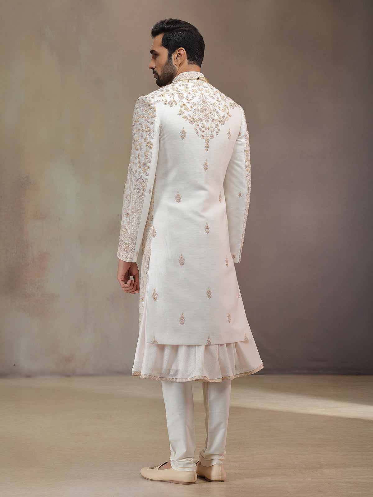 Cream peshwa style silk sherwani with rich embroidery