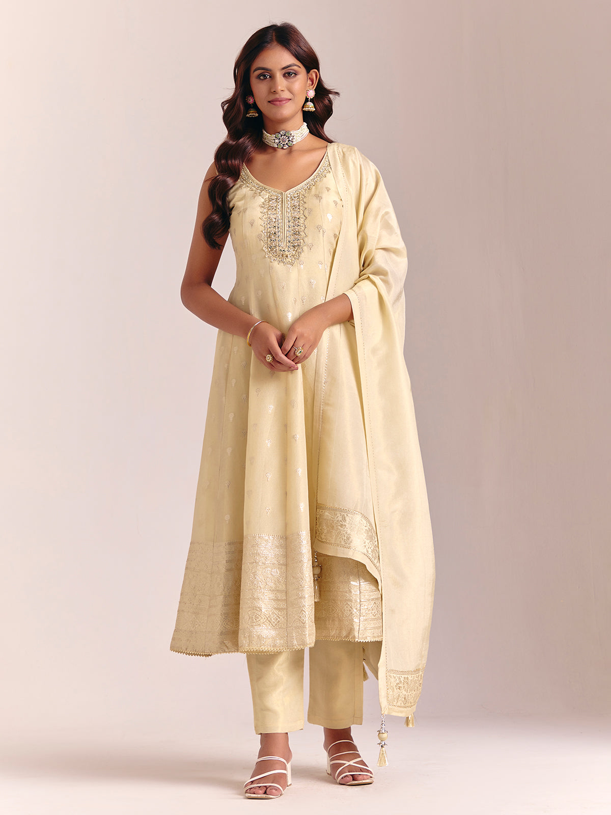 Cream silk sleeveless salwarsuit with dupatta