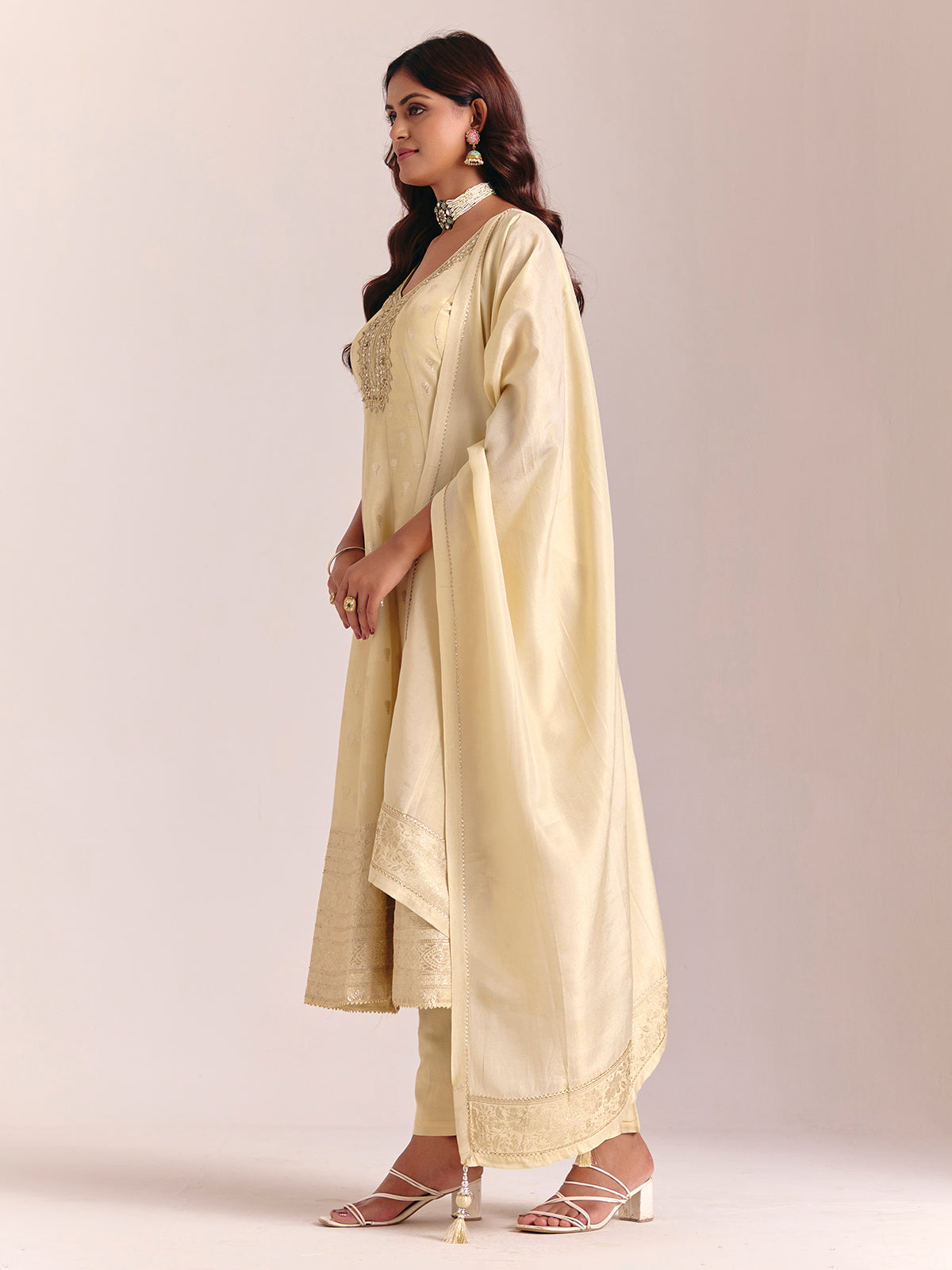 Cream silk sleeveless salwarsuit with dupatta