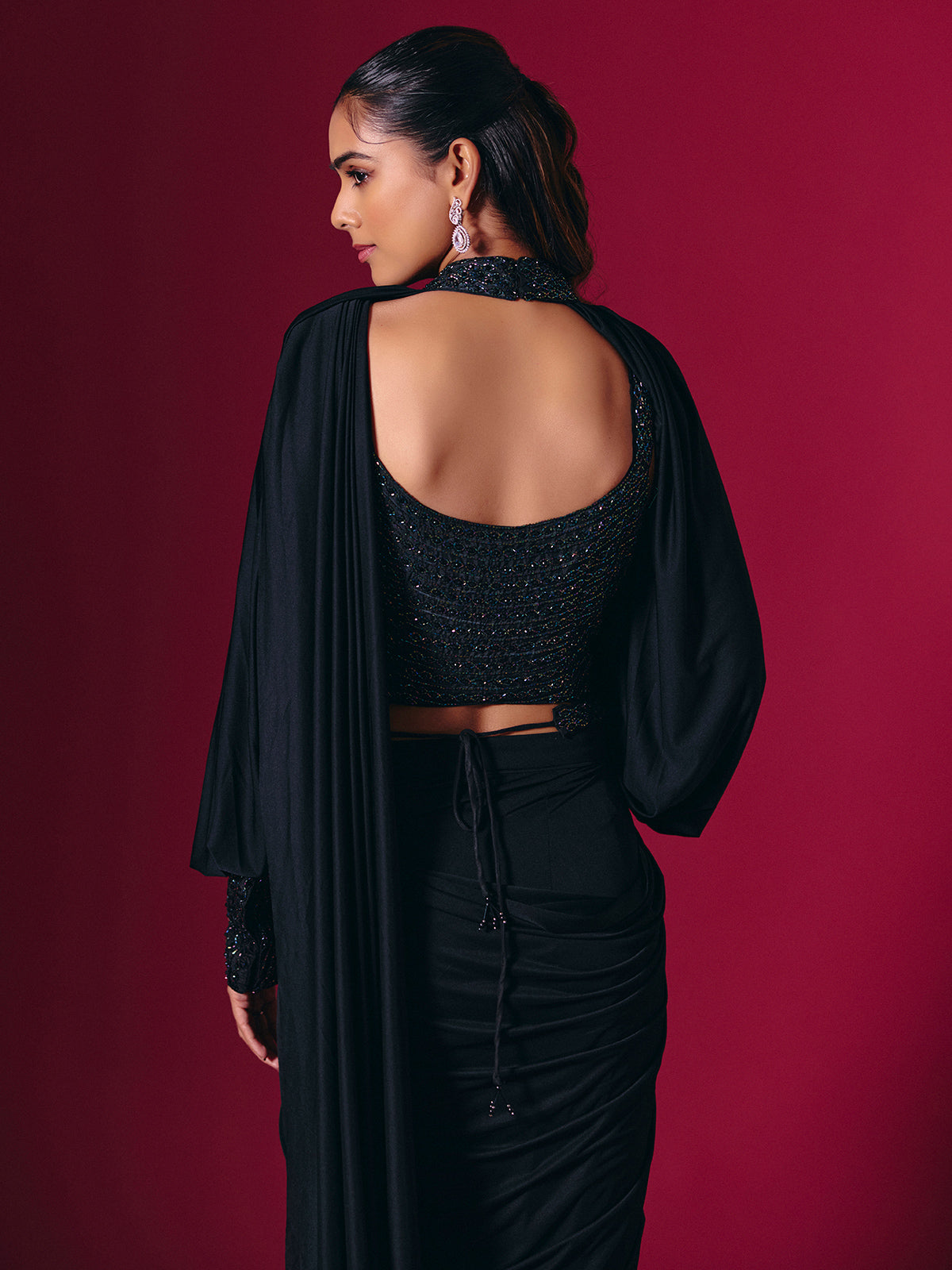 Elegant black lycra saree with cutdana pearl work