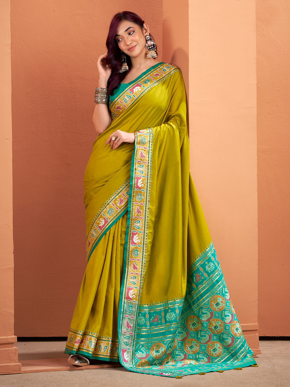 Mehendi green patola saree with traditional flair