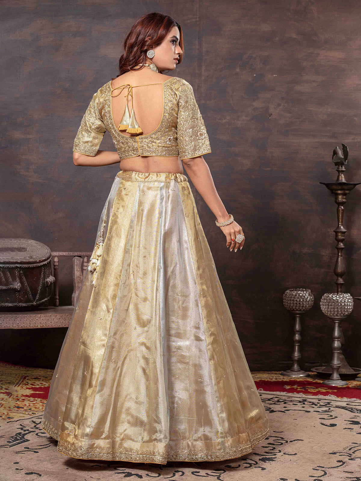 Golden lehenga choli with heavy weaving