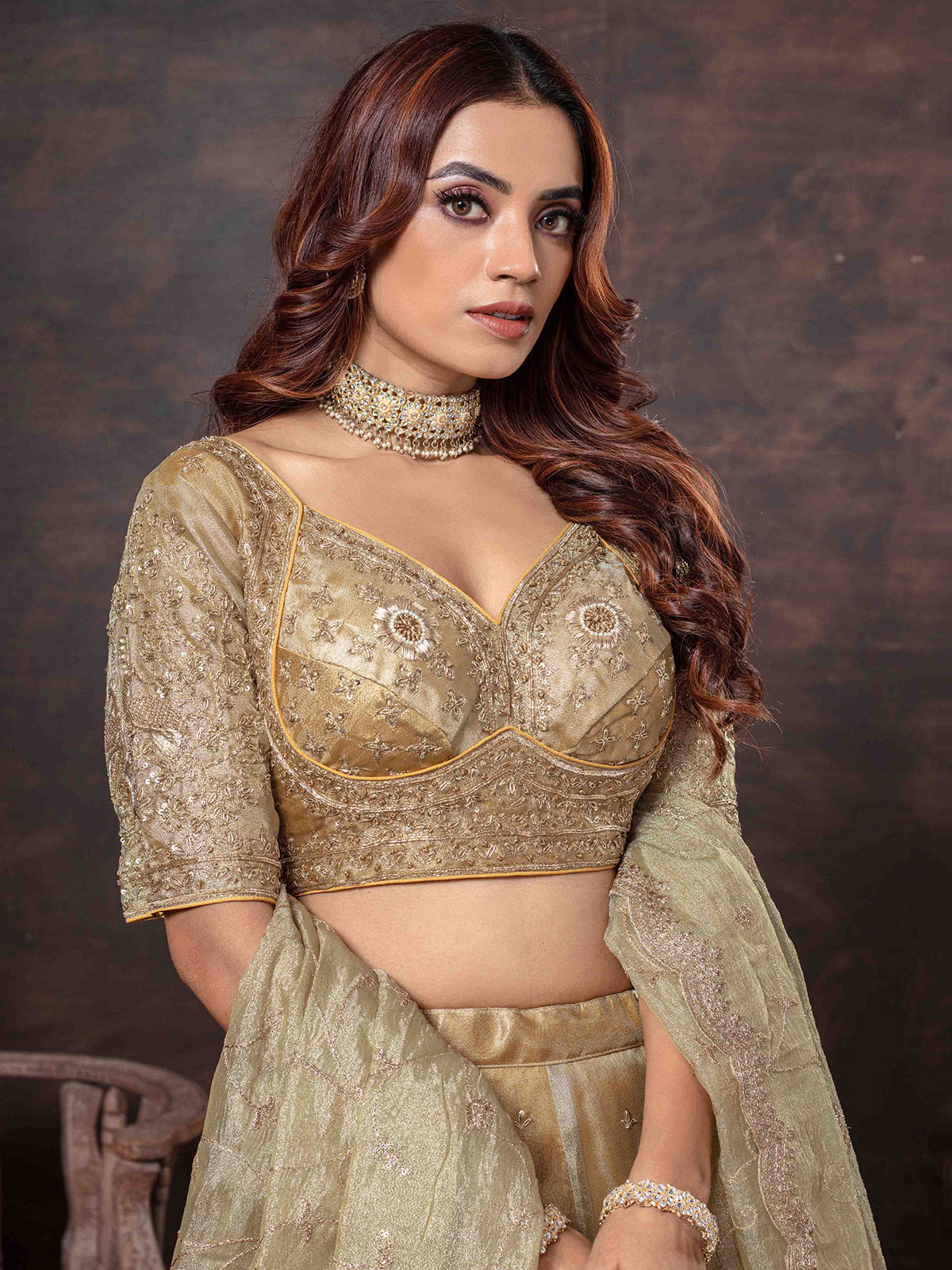 Golden lehenga choli with heavy weaving