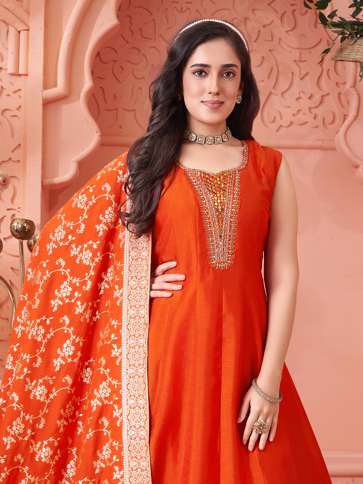 Orange silk salwar suit with shimmering zari and mirror glow