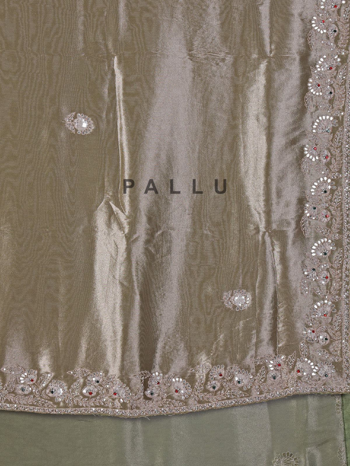 Pastel olive soft tissue silk saree with intricate festive embellishments