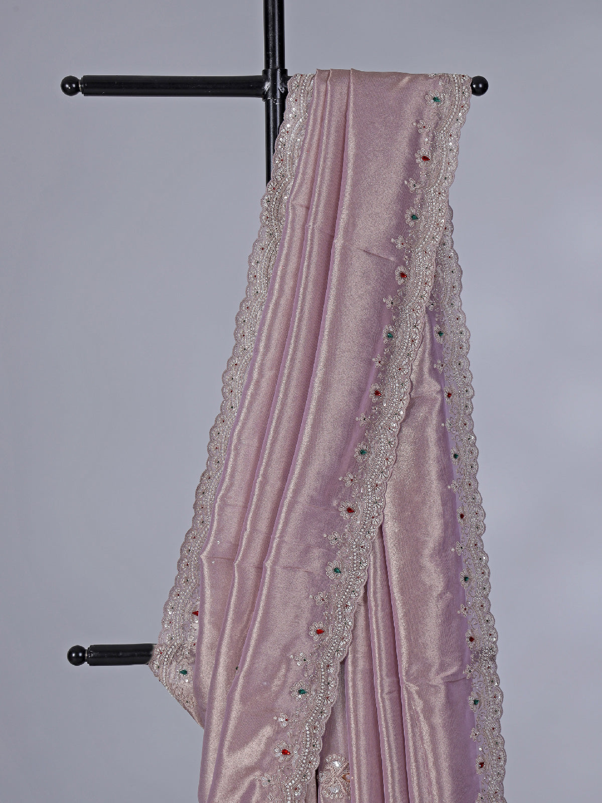 Pastel purple tissue silk saree with stone embellishments