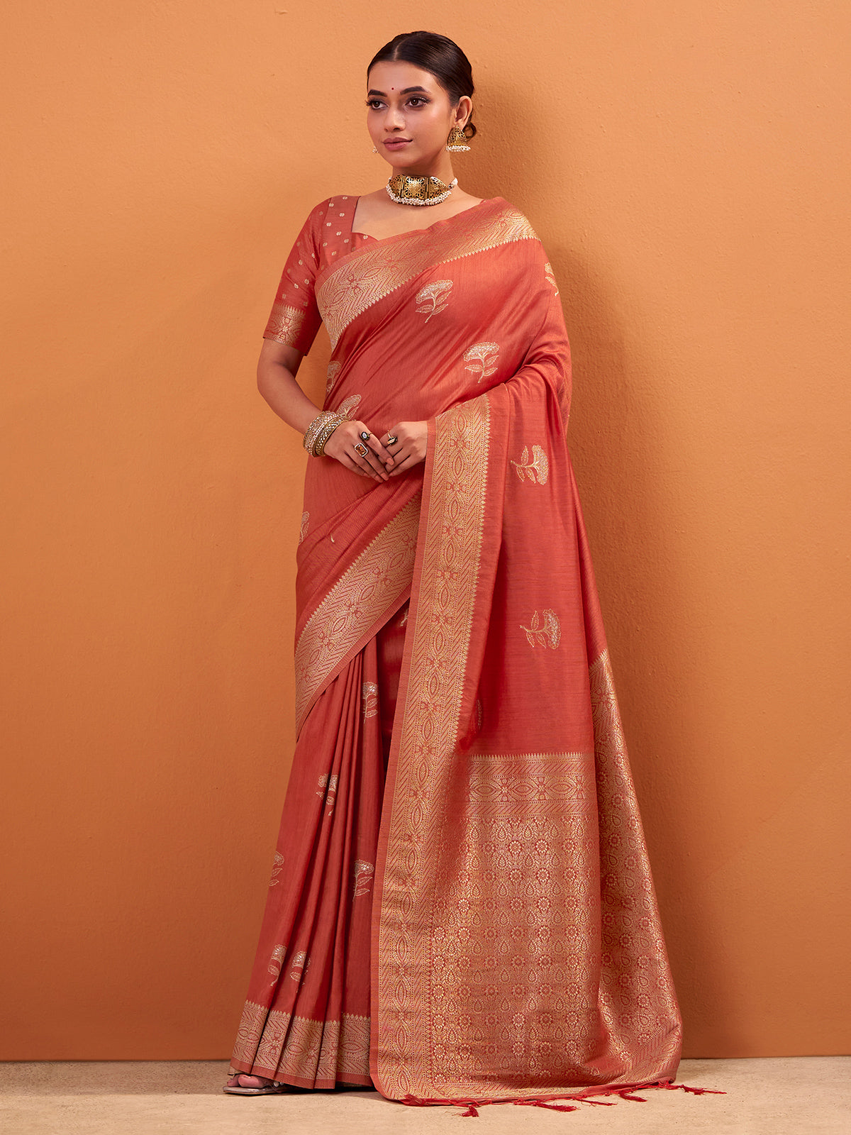 Peach tusser silk saree embellished with zari weaves