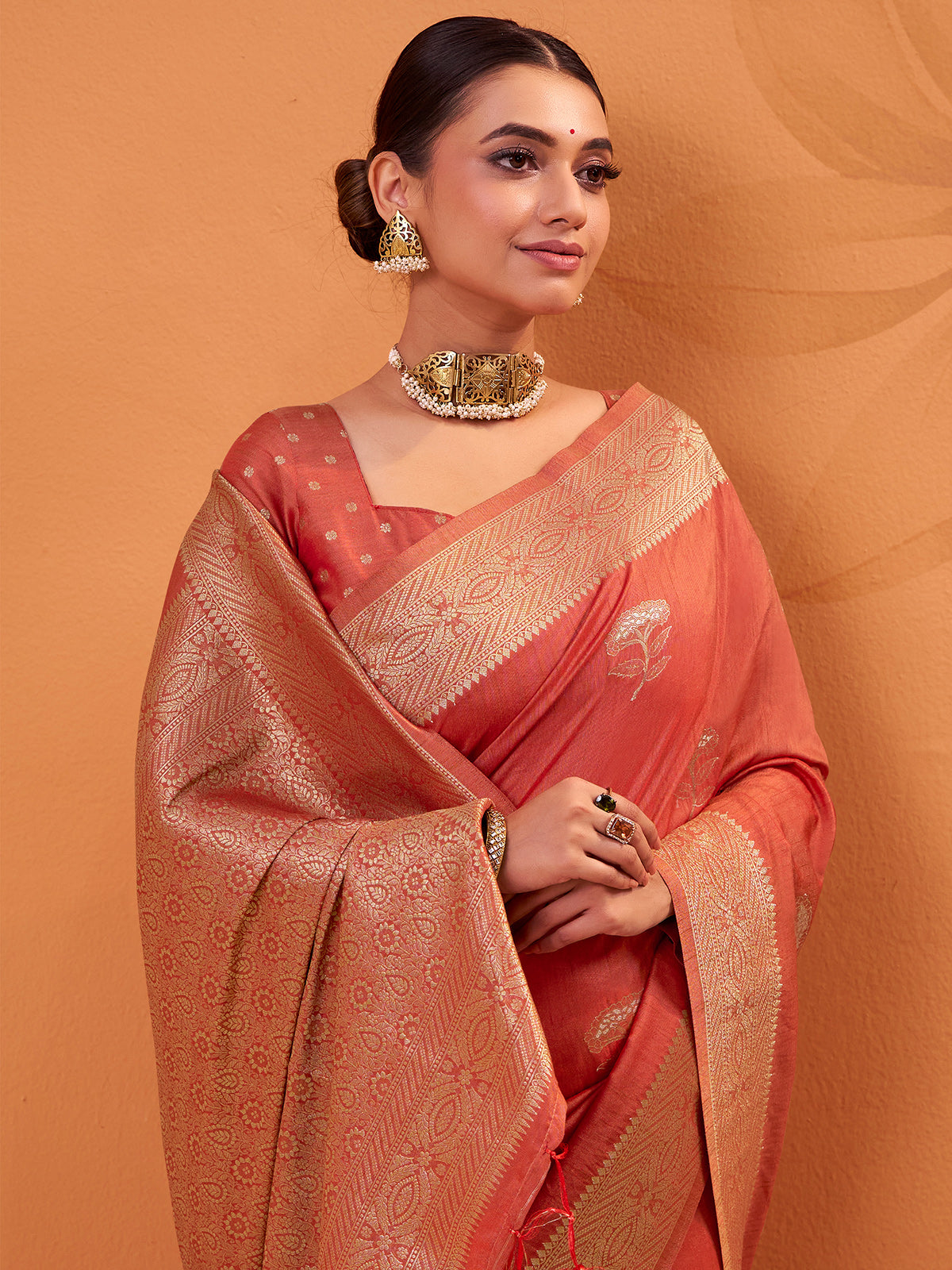 Peach tusser silk saree embellished with zari weaves