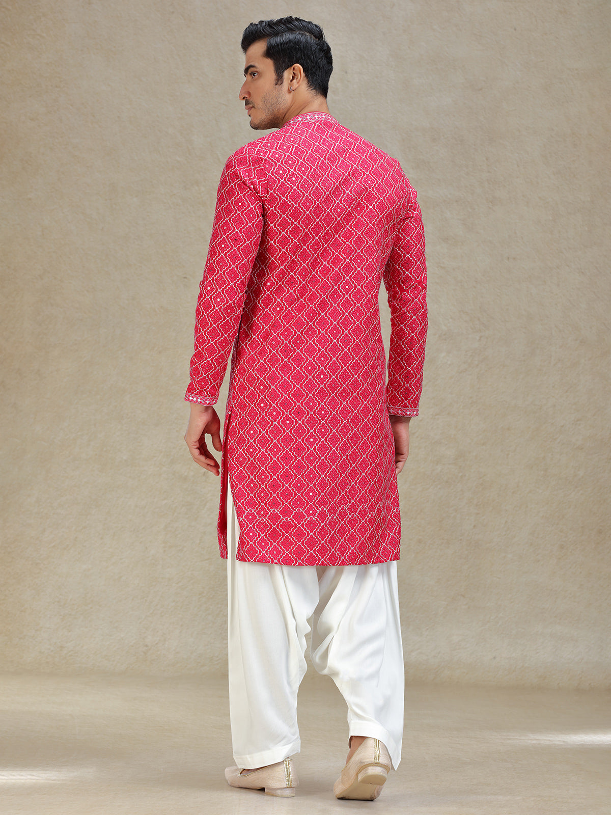 Pink kurta salwar in symmetrical embroidery pattern