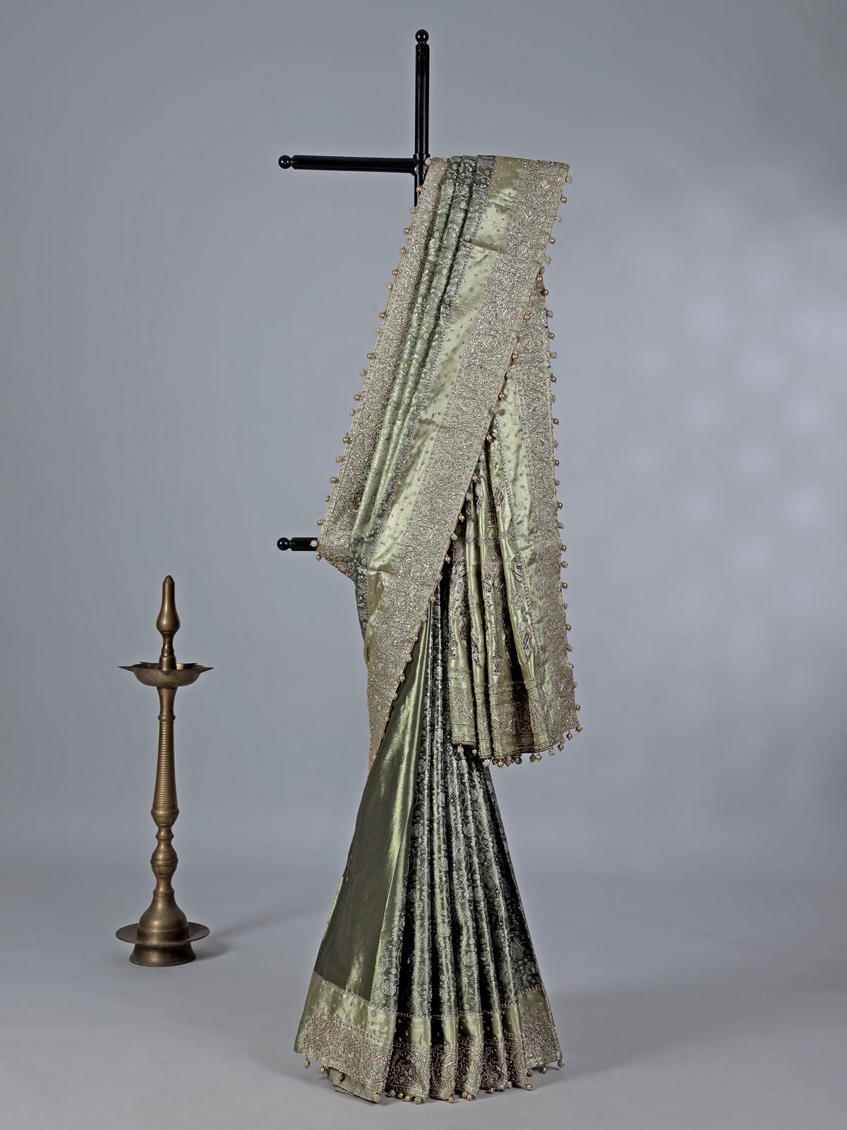 Pista green kanjivaram silk saree with ornate embellishments
