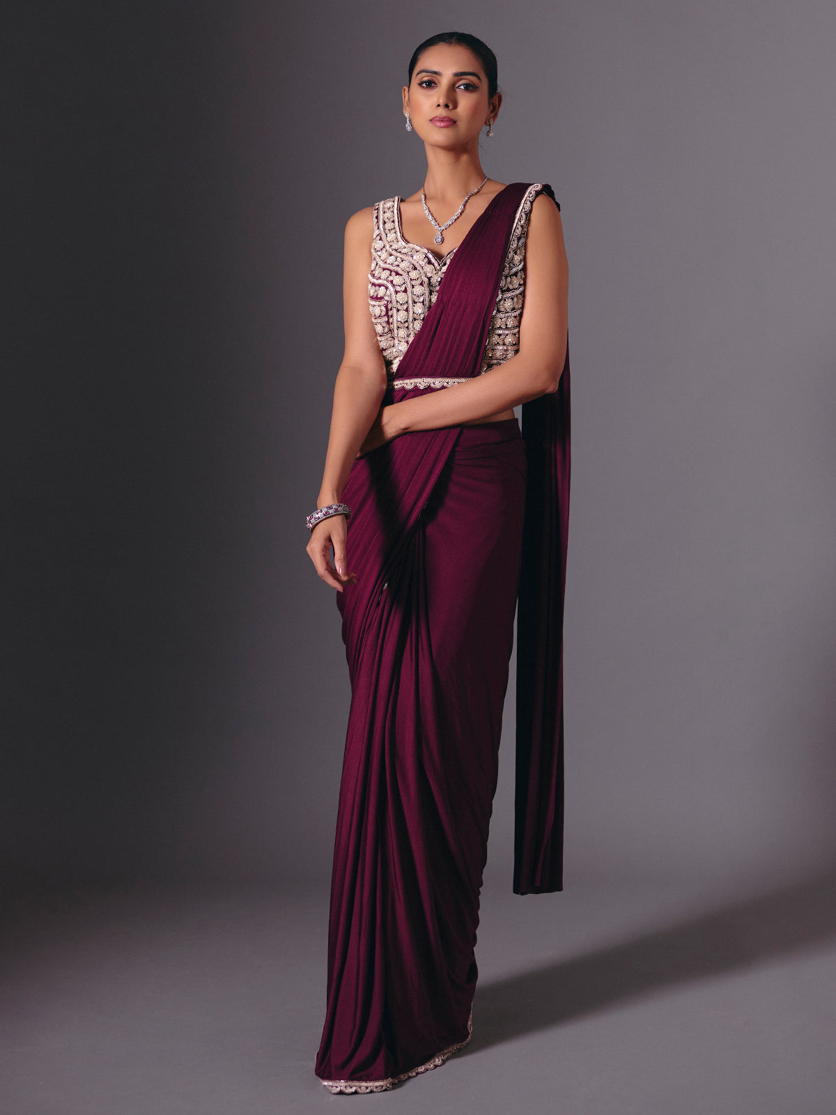 Wine lycra saree with sparkling cutdana and pearl work