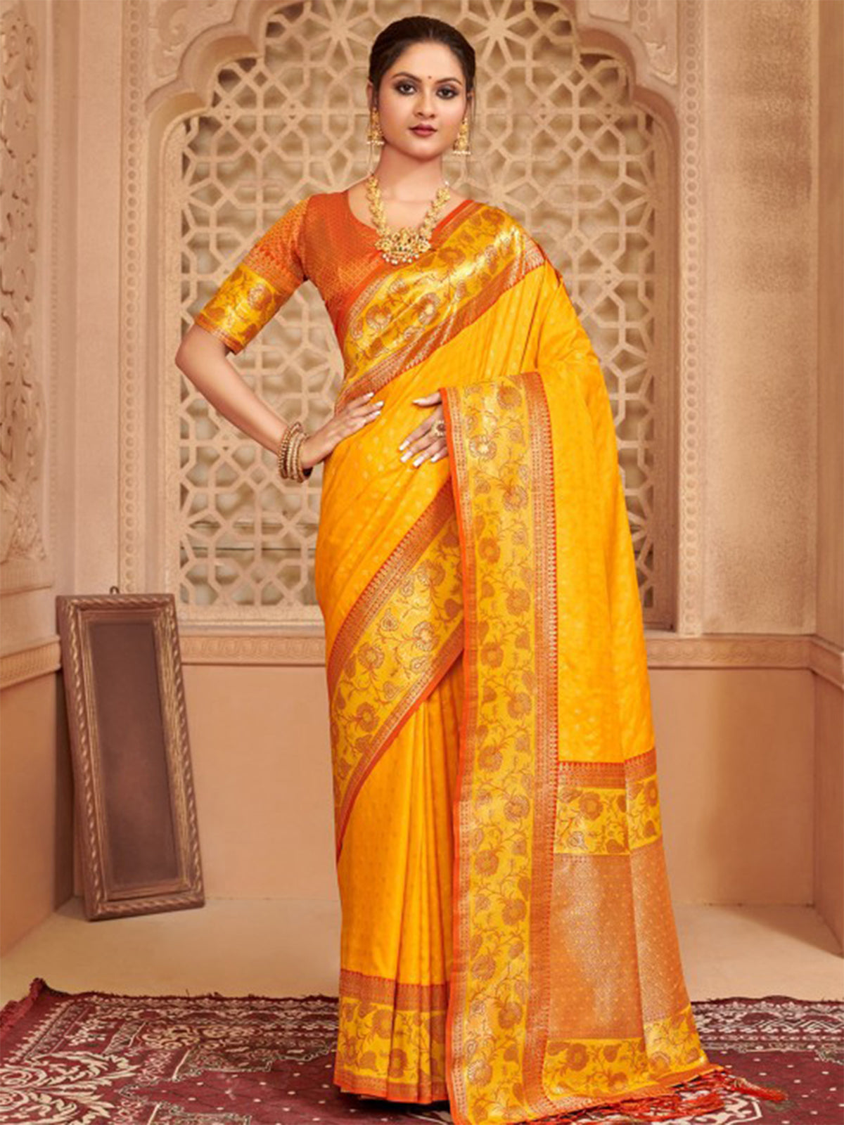 Yellow silk saree with colorful motifs