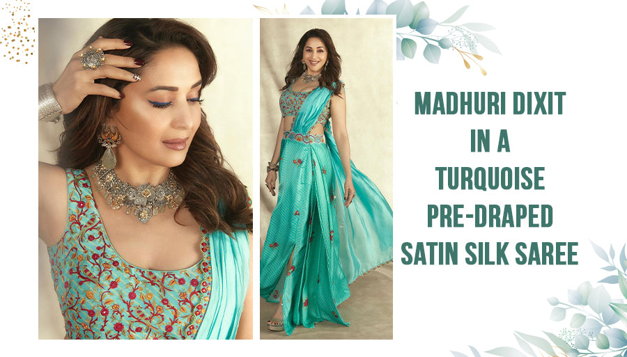 Madhuri Dixit in a turquoise satin silk saree
