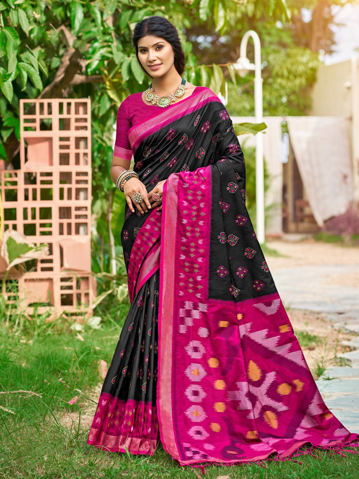 Black printed silk saree with contrast border and pallu