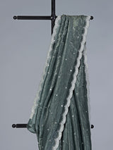 Rama green tissue silk saree with elegant embellishments