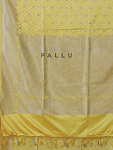 Yellow semi silk saree with festive zari detailing