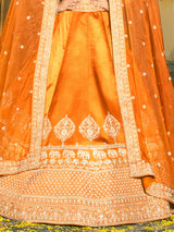 Orange raw silk lehenga choli with embellished dupatta
