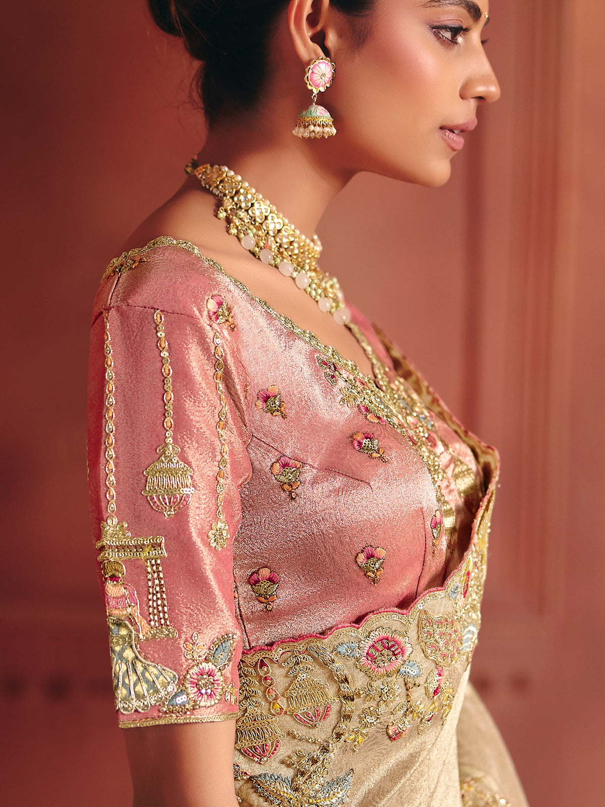 Beige bridal saree featuring exquisite traditional craftsmanship