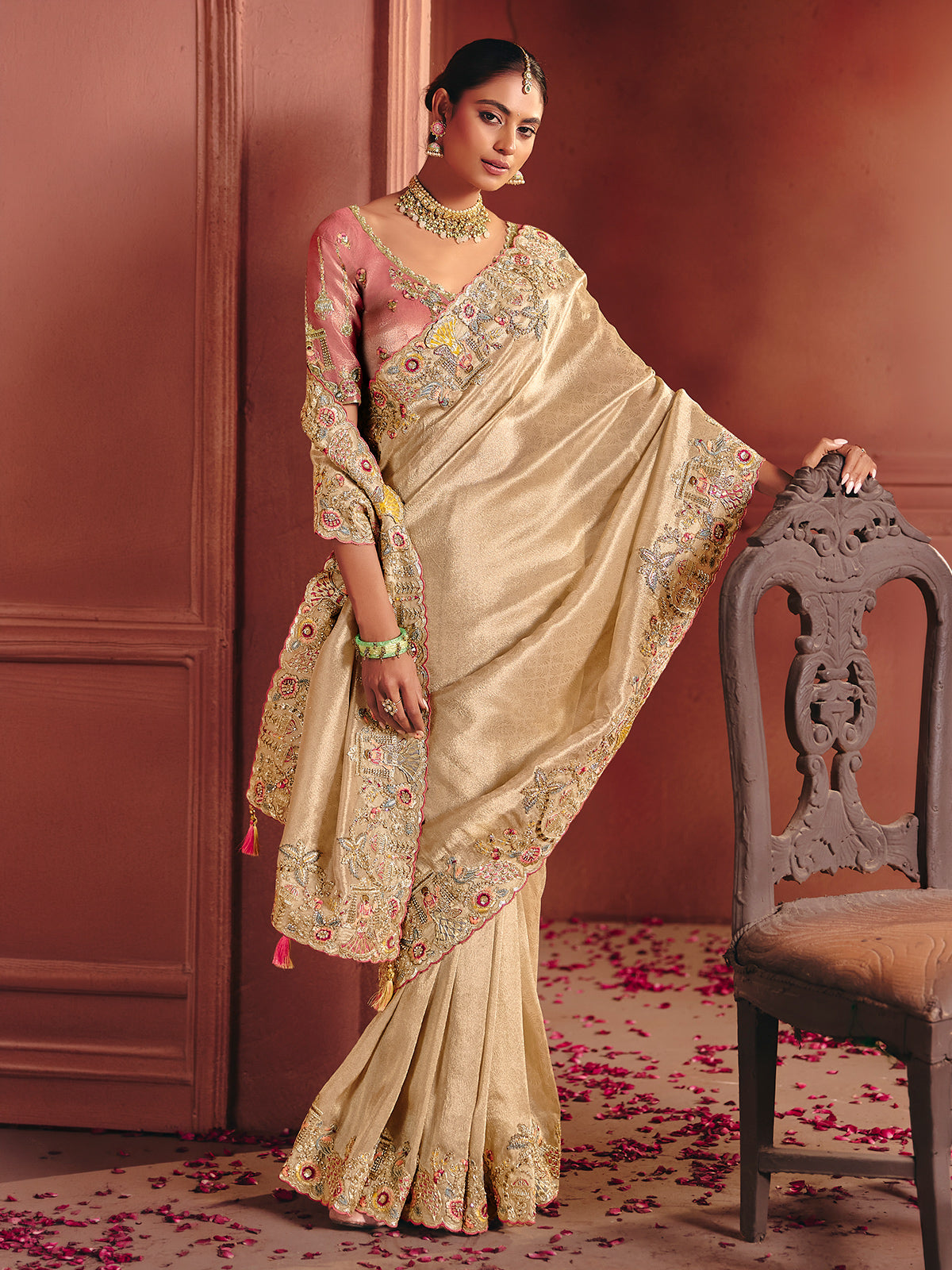 Beige bridal saree featuring exquisite traditional craftsmanship