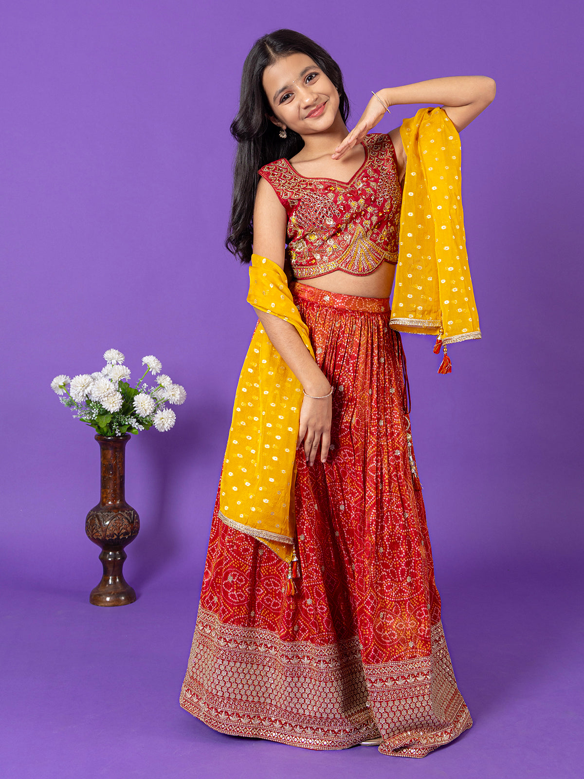 Red silk bandhej print lehenga choli with stones work for girls