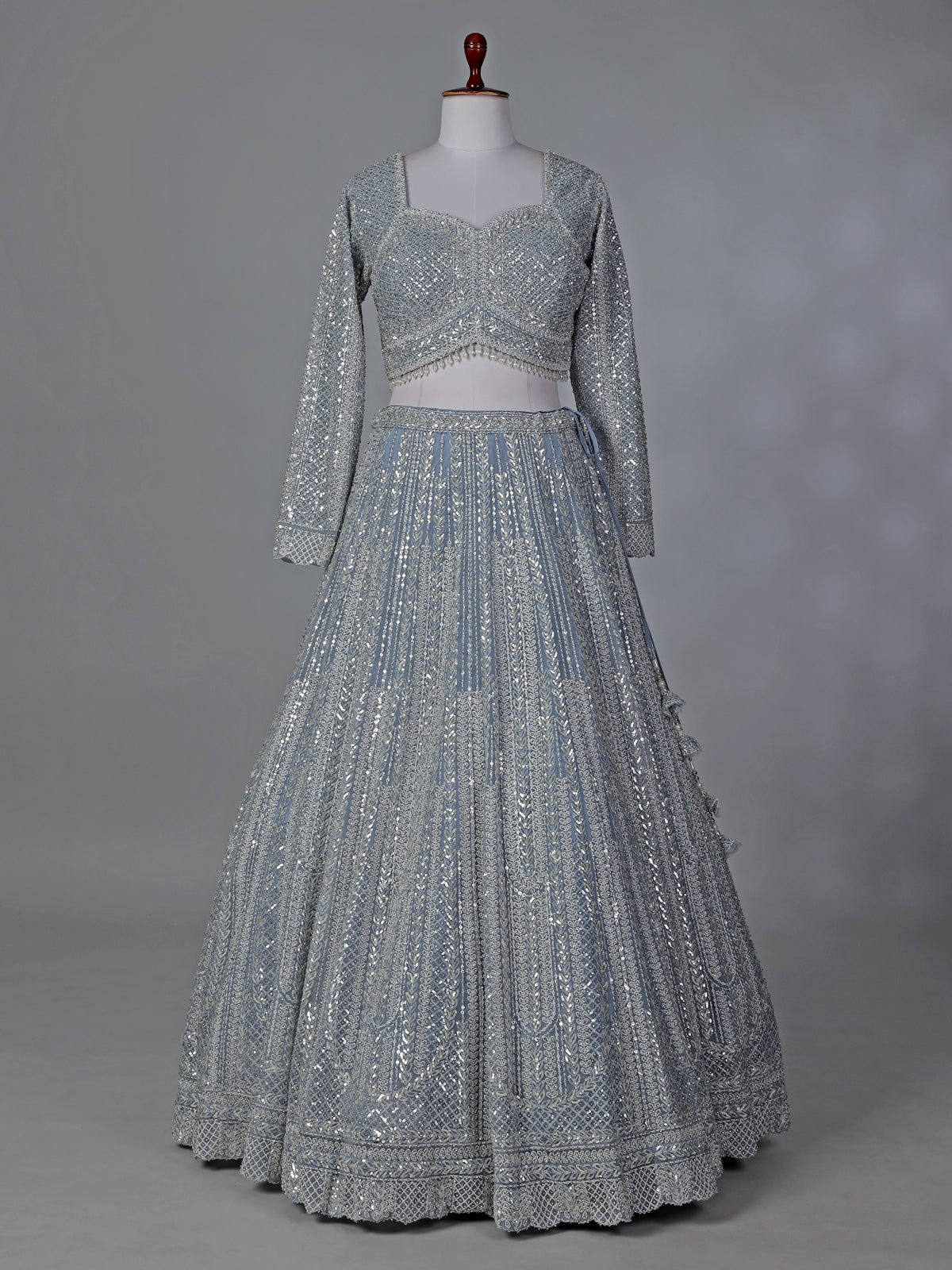 Grey wedding wear net lehenga choli with sequins detailing