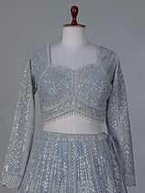 Grey wedding wear net lehenga choli with sequins detailing