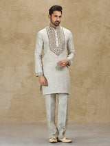 Beige linen kurta suit with colorful embroidery