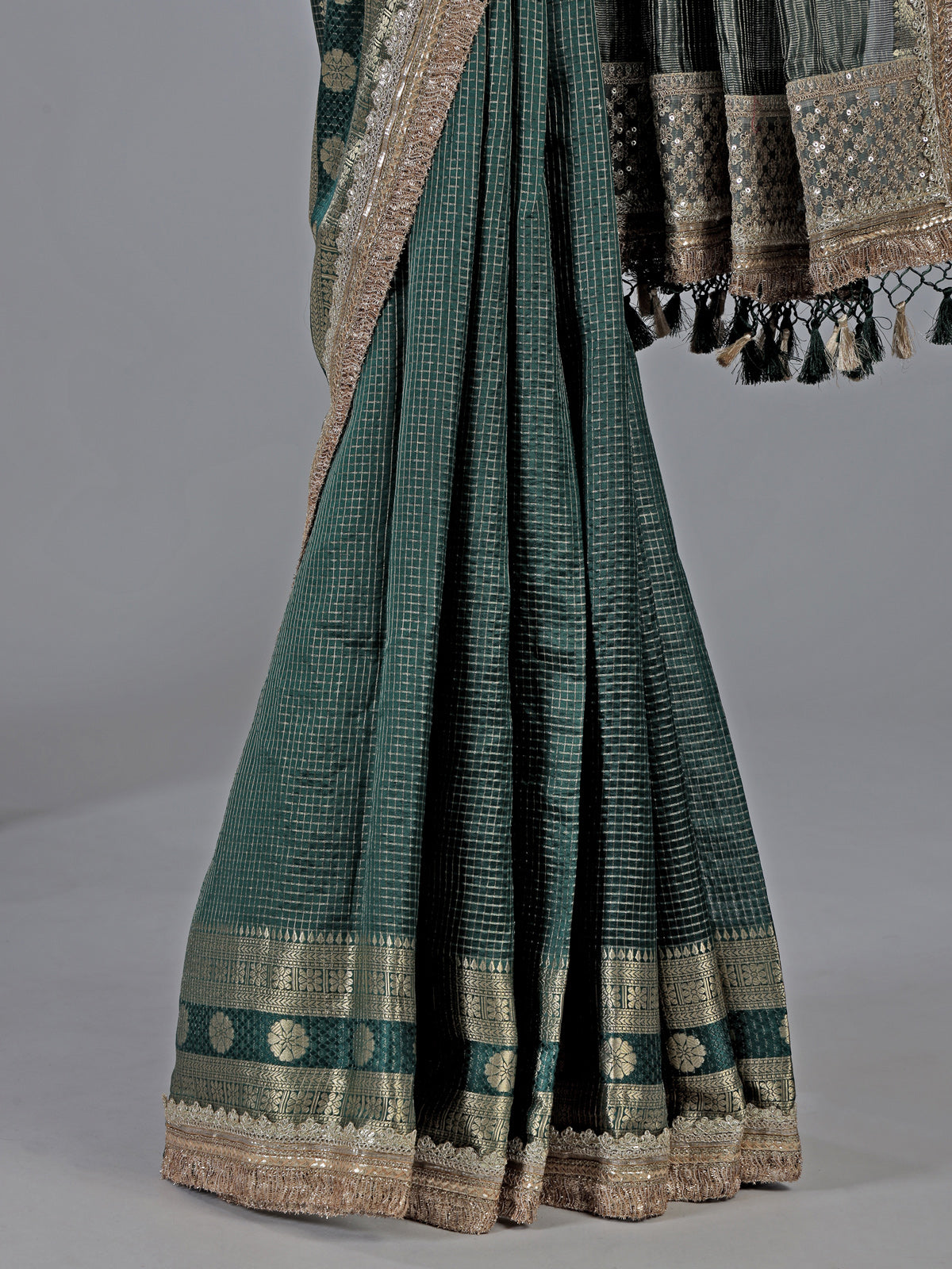 Bottle green dola silk saree with zari weaving