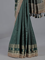 Bottle green dola silk saree with zari weaving