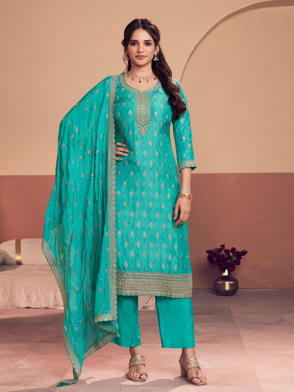 Aqua blue silk salwar suit with zari detailing