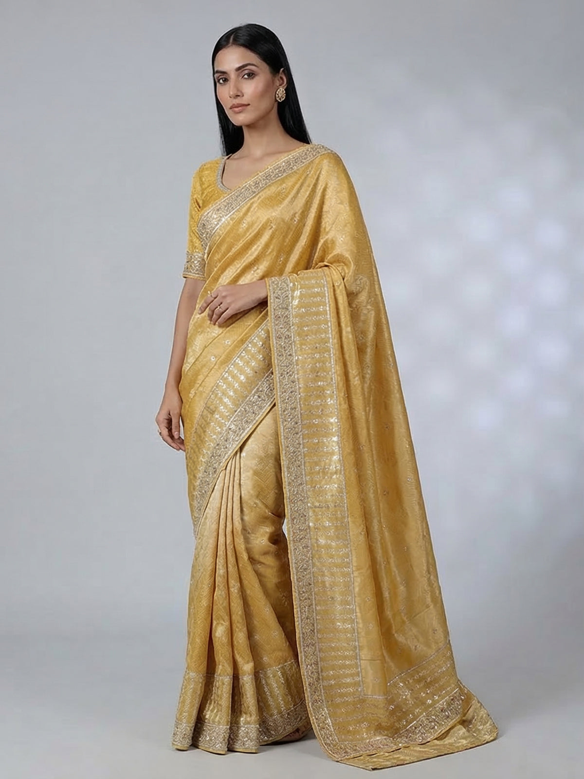 Mustard yellow tissue saree with cutdana work