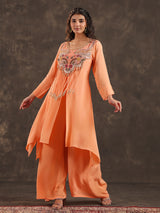 Light peach yoke style palazzo suit with festive embellishments