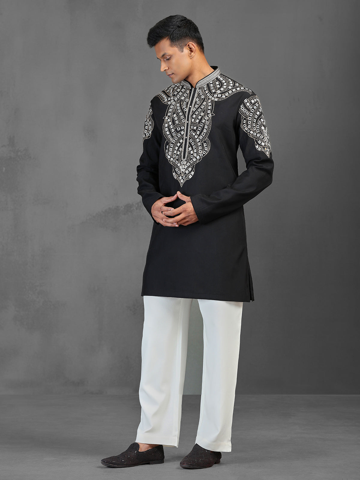 Black art silk kurta suit for a charming wedding look