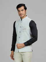 Mint blue linen wedding waistcoat with embellished pocket