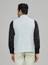 Mint blue linen wedding waistcoat with embellished pocket