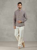 Grey linen waistcoat set with zardosi embellished crest