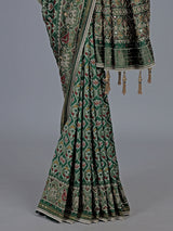 Green art patola silk saree with sequins and zardosi accents